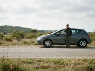 Car stopped on roadside with driver using phone for roadside assistance in Canada